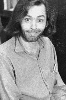 Charles Manson sticks his tongue out at photographers as he appears in a Californian courtroom, charged with the slaying of musician Gary Hinmanon June 25, 1970.