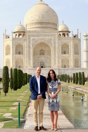 Prince William, Duke of Cambridge and Catherine, Duchess of Cambridge pose next to the Taj Mahal.
