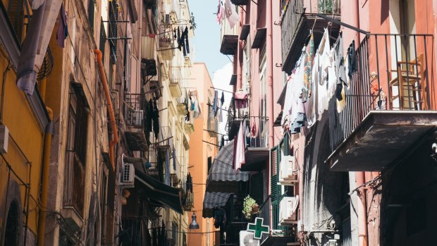 Laundry lines criss-cross the narrow streets.