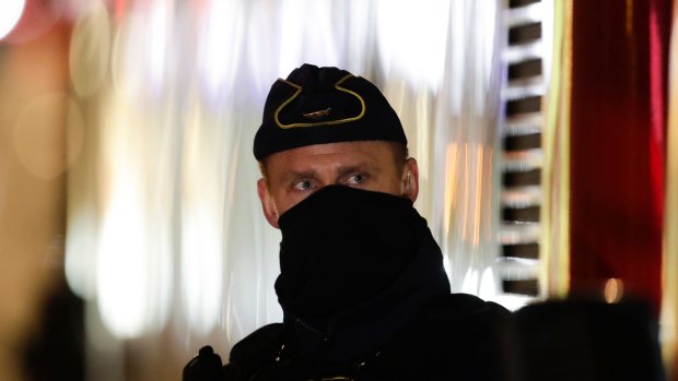 A police officer guards the scene after a truck was driven into a department store in Stockholm, Sweden.