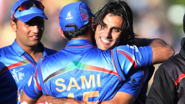 Winners are grinners: Afghanistan's Shapoor Zadran after hitting the winning runs against Scotland.