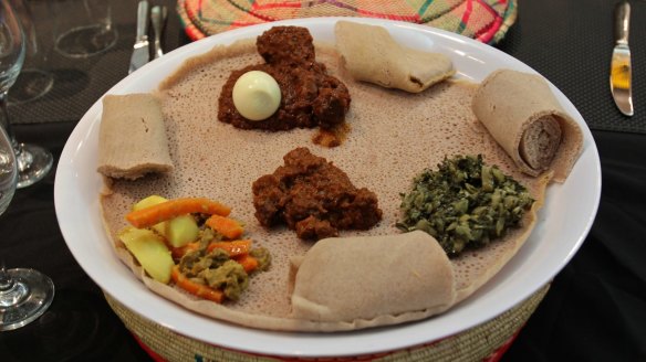 Spongy injera bread is the perfect base for Ethiopian stews and accompaniments.