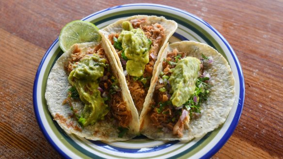Don't miss the carnitas - slow-cooked shredded pork tacos.