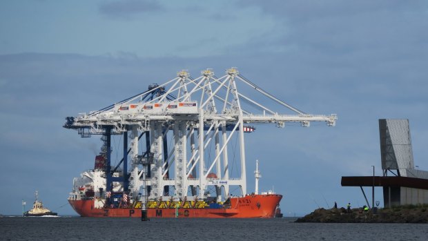 A container ship arrives at the Port of Melbourne.