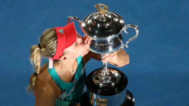 Angelique Kerber kisses the trophy after winning the Women's Singles final.