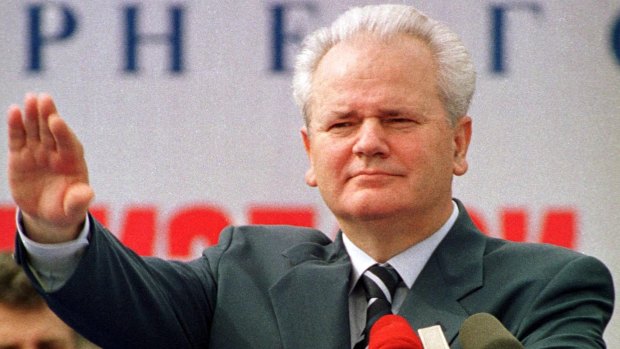 Then Yugoslav president Slobodan Milosevic waves to his supporters gathered in northern Montenegro in  2000.