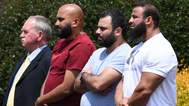 Raed Darwiche, second from right, the father of Jihad Darwiche, at the service on Monday.