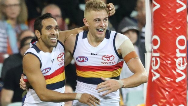 Crow Hugh Greenwood is congratulated by Eddie Betts after kicking his second goal.