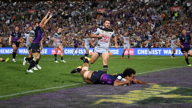 Bolter: Melbourne back-rower Felise Kaufusi scores a try in Sunday night's grand final victory.