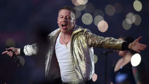 US artist Macklemore sang to rapturous applause from fans in the front row, the stands at ANZ Stadium and on social media.