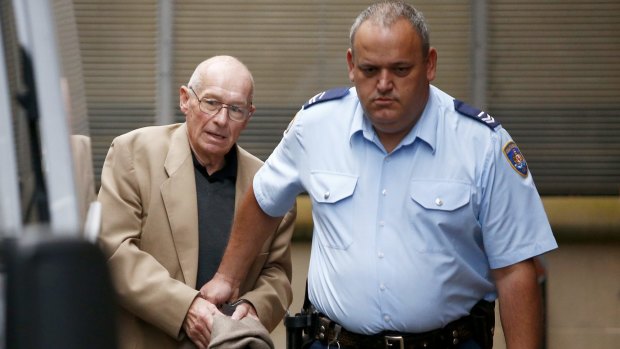 Roger Rogerson escorted out King St court complex during his murder trial.