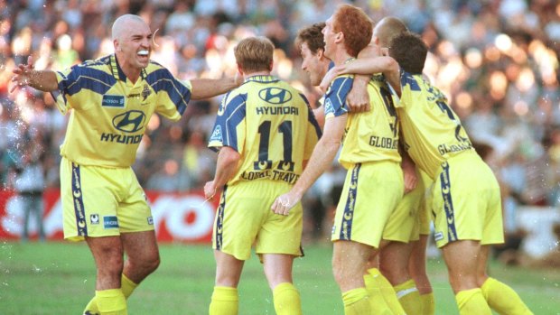 Alan Hunter (left) celebrates during the Brisbane Strikers' NSL grand final victory, 20 years ago to the day.