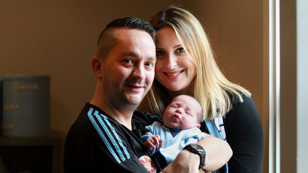 'Going to the semi-final on the day of Alfie's birth would have been pushing the envelope too far': Phil Rice and wife Melissa Rice with their newborn son Alfie. 