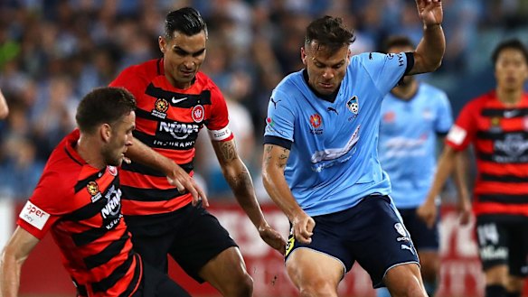 Marked man: Sydney FC marquee Bobo is challenged by Robbie Cornthwaite.