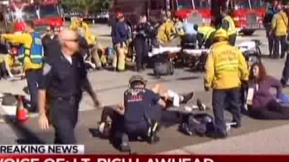 Victims are treated on the road after the shooting.