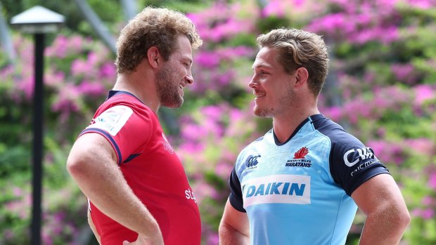 State rivals: James Slipper of the Reds and Michael Hooper of the Waratahs.
