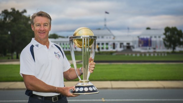 Former Australian player Andy Bichel with the ICC World Cup trophy in Canberra on Monday.
 
