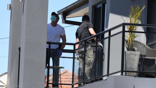 Police raid a home in Merrylands on Thursday.