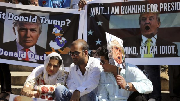 Indian Muslims hold placards during a protest against Donald Trump in Bangalore earlier this month.