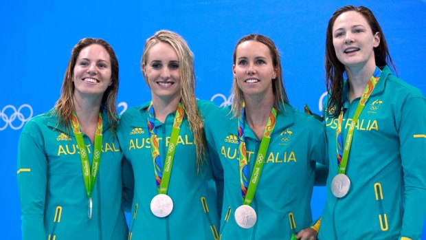 Silver lining: Silver medalists Emily Seebohm, Taylor McKeown, Emma McKeon and Cate Campbell celebrate on the podium during the medal ceremony for the 4x100m medley relay final .