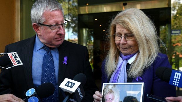 Mark and Faye Leveson with a photograph of their son Matthew Leveson. 