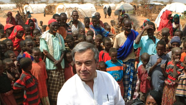Then UN High Commissioner for Refugees Antonio Guterres is surrounded by Somali refugees in 2011.