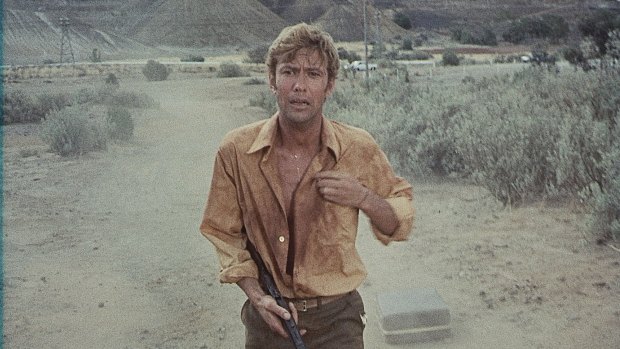 Gary Bond plays John Grant, a teacher stranded in an outback town. 