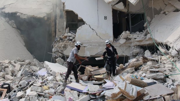 Aleppo after being hit by barrel bombs. US has doubts about Russia's intentions in Syria. 