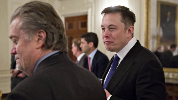 Elon Musk, co-founder and chief executive of Tesla Motors, right, and Steve Bannon, chief strategist for US President Donald Trump.