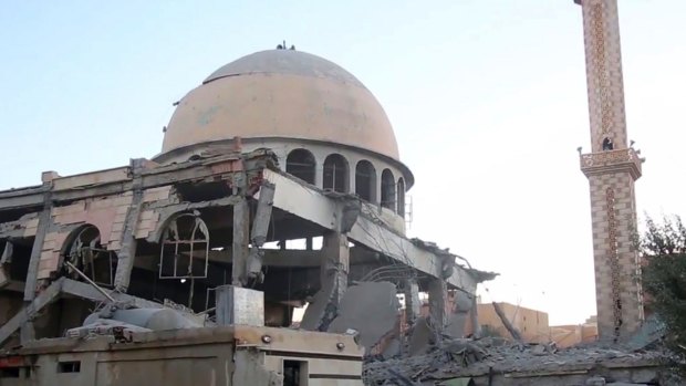 An image distributed by IS's propaganda agency Amaq shows a Raqqa mosque damaged by the coalition earlier this month.