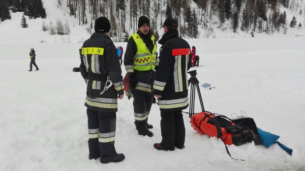 Rescuers prepare to board helicopters in Valle Aurina in the Italian Alps to reach the area on Monte Nevoso where six skiers have died in an avalanche.