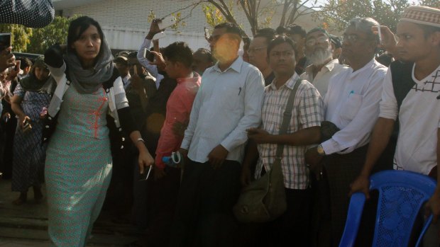 Yin Ngwe Khine, left, daughter of Ko Ni,  arrives at her father's funeral.