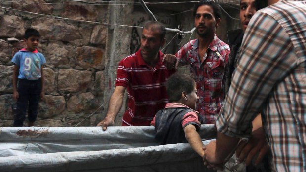 A boy is rescued in Aleppo following what activists say was an intensive day of bombing by Russian and Syrian planes on Tuesday.