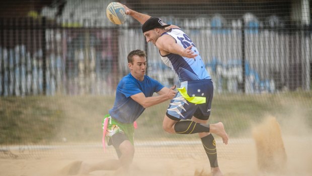 Players compete in the Tag Rugby ACT Beach Bash in Lyneham on Saturday morning. 