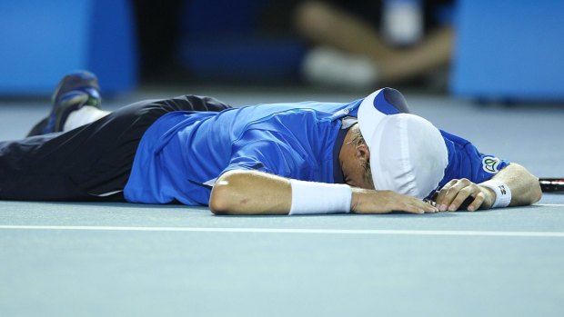 Hewitt is exhausted after beating Baghdatis in 2008.