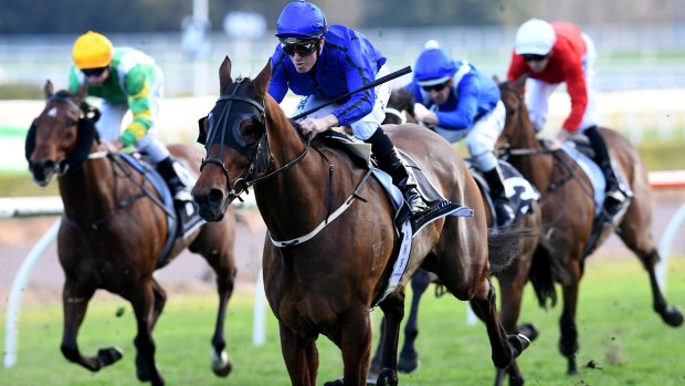 Fast finish: Josh Adams rides Happy Clapper to win the Tramway Stakes.