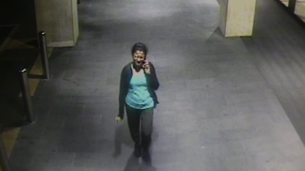 A CCTV image of Prabha Arun Kumar talking on the phone to her husband minutes before she was stabbed.