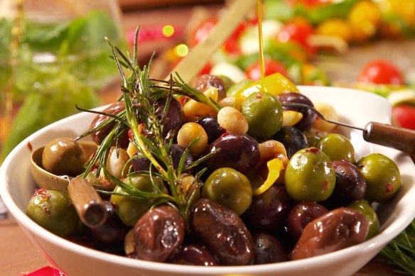 Warm olives with macadamias and chilli