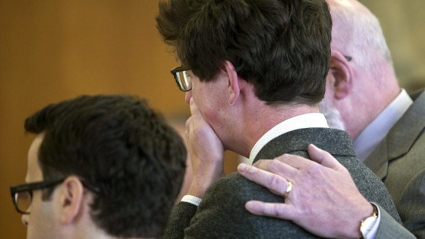 Relief: Attorney J.W. Carney puts his arm around Owen Labrie, as he weeps in court.