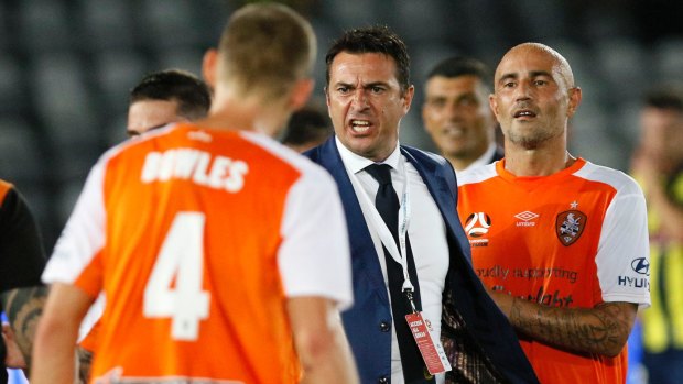 Extra time: An angry Mariners coach Paul Okon takes offence to something said after the final whistle.