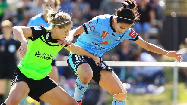 Canberra United defender Ellie Brush (left) wants the W-League to have a full home and away season.