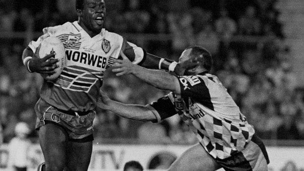 Old rivals: Wigan’s Martin Offiah takes on Brisbane in 1994. 