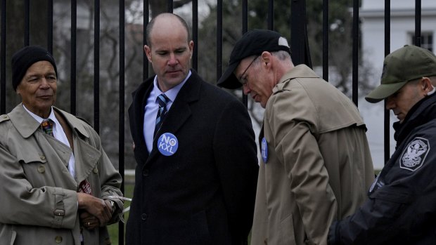 Bill McKibben (black cap) was among activists arrested outside the White House in 2013 protesting against the proposed expansion of the Keystone oil pipeline. Two years later, the expansion was canned.