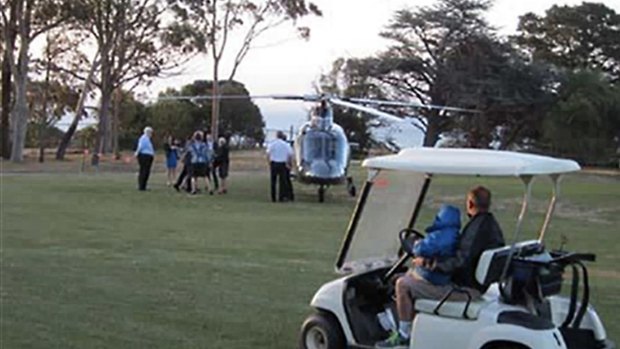 Bronwyn Bishop arrives by helicopter at a golf course for a Liberal fundraiser.