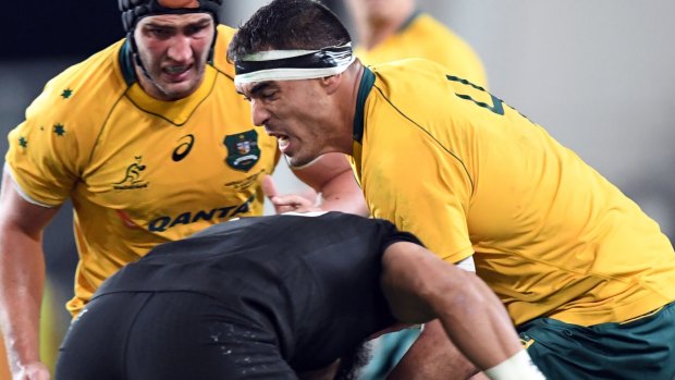 Tall timber: Rob Simmons crashes into Brodie Retallick of New Zealand during the second Bledisloe in Dunedin.