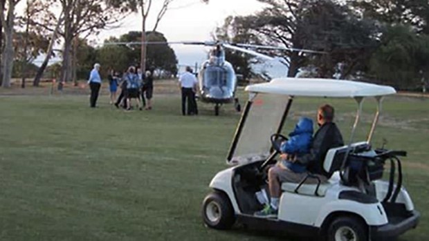 Bronwyn Bishop arrives by helicopter at a golf course for a Liberal fundraiser.