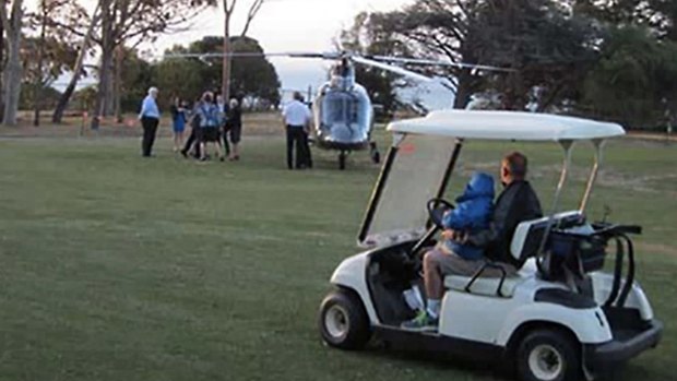 Bronwyn Bishop arrives by helicopter at a golf course for a Liberal fundraiser.