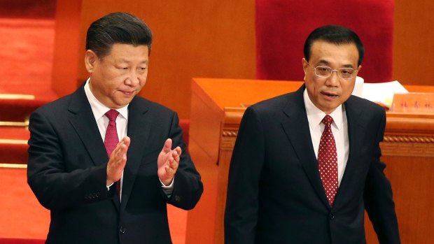 President Xi, standing beside Premier Li, is expected to consolidate his grip on power for the next five years.