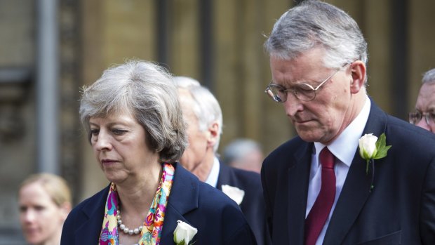 Theresa May, seen here with Labour's fallen shadow foreign secretary Hilary Benn, is mentioned as a possible opponent to Boris Johnson for the Tory leadership.