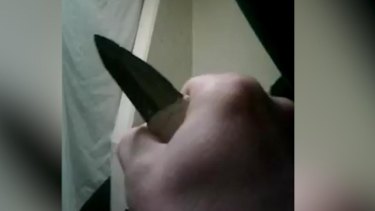 The inmate shows a knife to the camera, along with an improvised weapon known as a 'slasher'. 